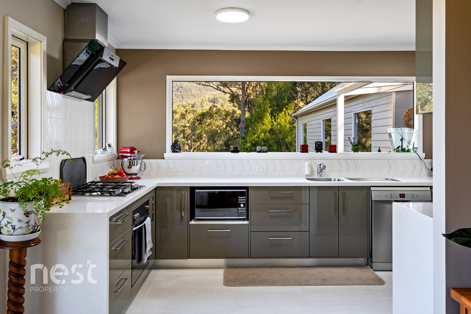 What are the benefits of choosing Nest Property Management for your property investment needs?